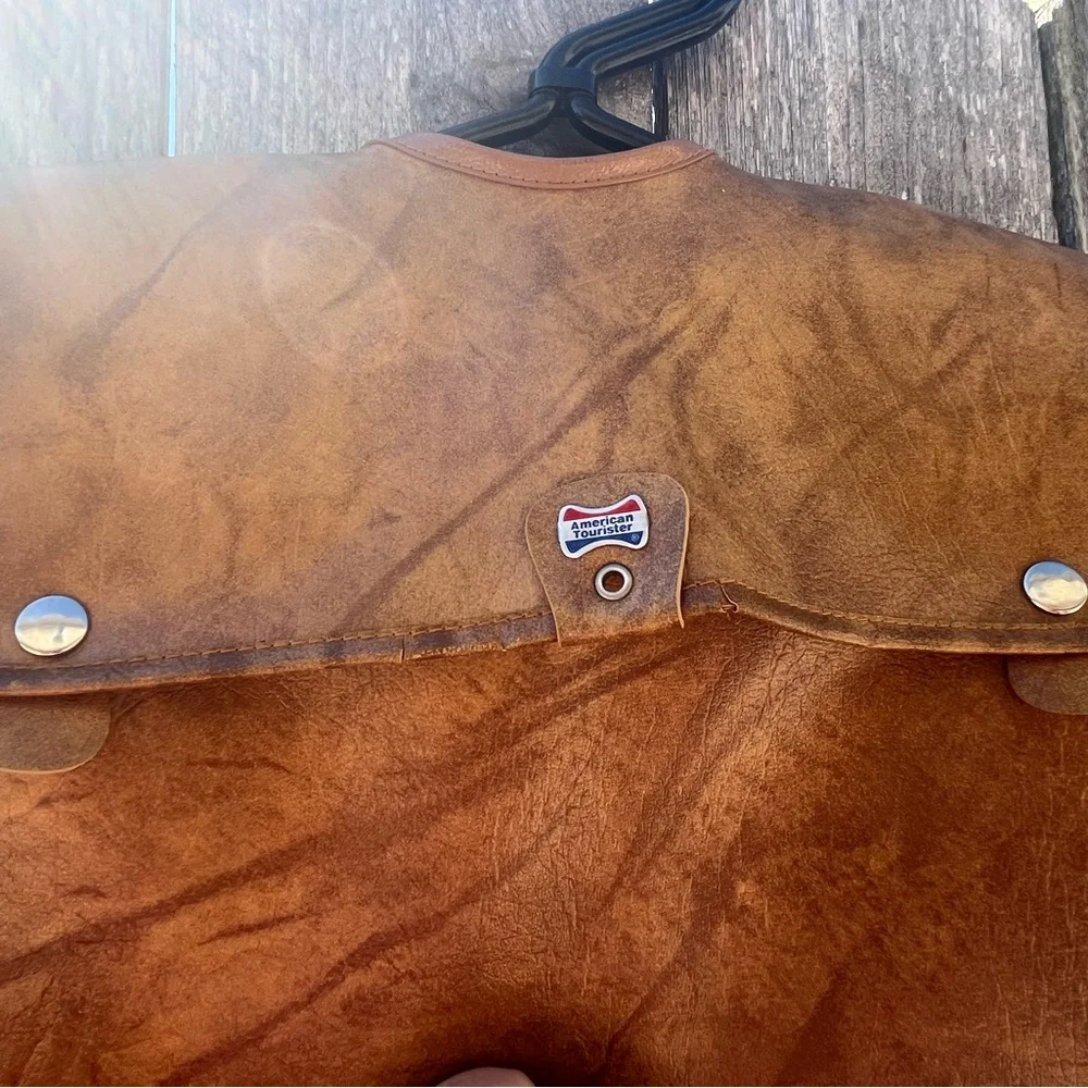 Vintage leather carry on for hanging clothes.